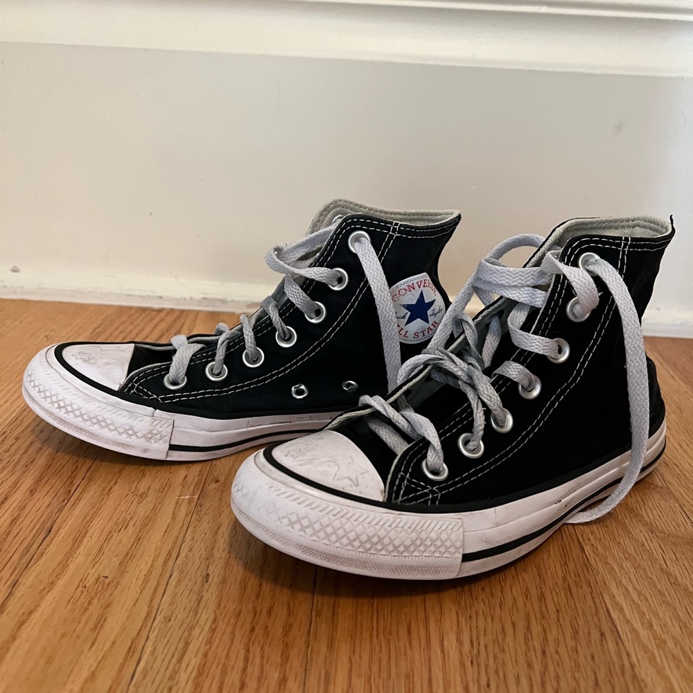 Black high top Converse sneakers